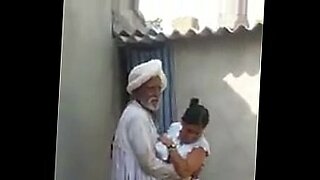 two old man breastfeeding the young girl