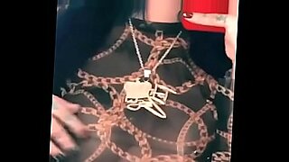 woman shocks a tied up man bound in ropes who has his cock in chastity device
