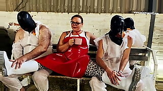 two latex lesbians strap on fuck a loser