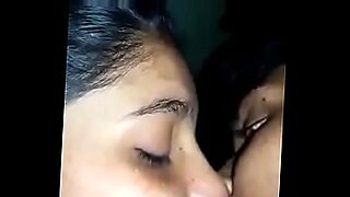 woman shocks a tied up man bound in ropes who has his cock in chastity device