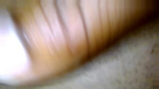 asian girl in black lingery masturbating with vibrators on the couch