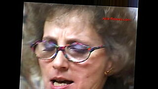 girl with glasses gives blowjob at video store