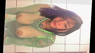 busty naked brunette babe on a shop floor gets a blowjob