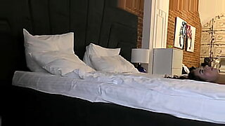 asian girl kissing getting her tits and pussy rubbed by the masseuse on the massage bed