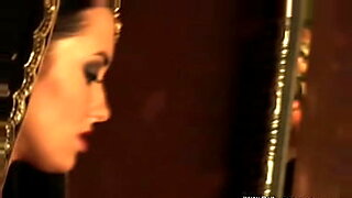 busty naked brunette babe on a shop floor gets a blowjob