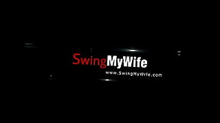 woman shocks a tied up man bound in ropes who has his cock in chastity device