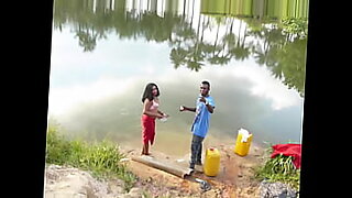 group of swinging couples playing with water guns outdoors