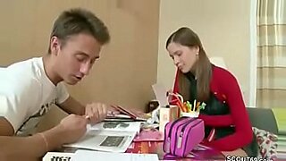 teenage sister brother in study room reading about sex