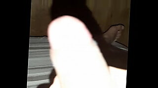 girl instructs man how to use a dildo