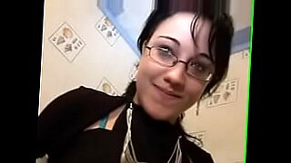 woman shocks a tied up man bound in ropes who has his cock in chastity device