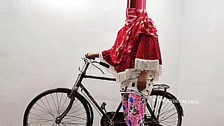 fucking herself with a dilldo in a on a bike