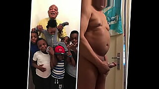 a girl is playing with black dildo with a boy